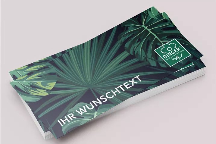 dingers-gutschein Eine grüne Gutscheinkarte mit Feld für Wunschtext-Eingabe auf grauem Hintergrund